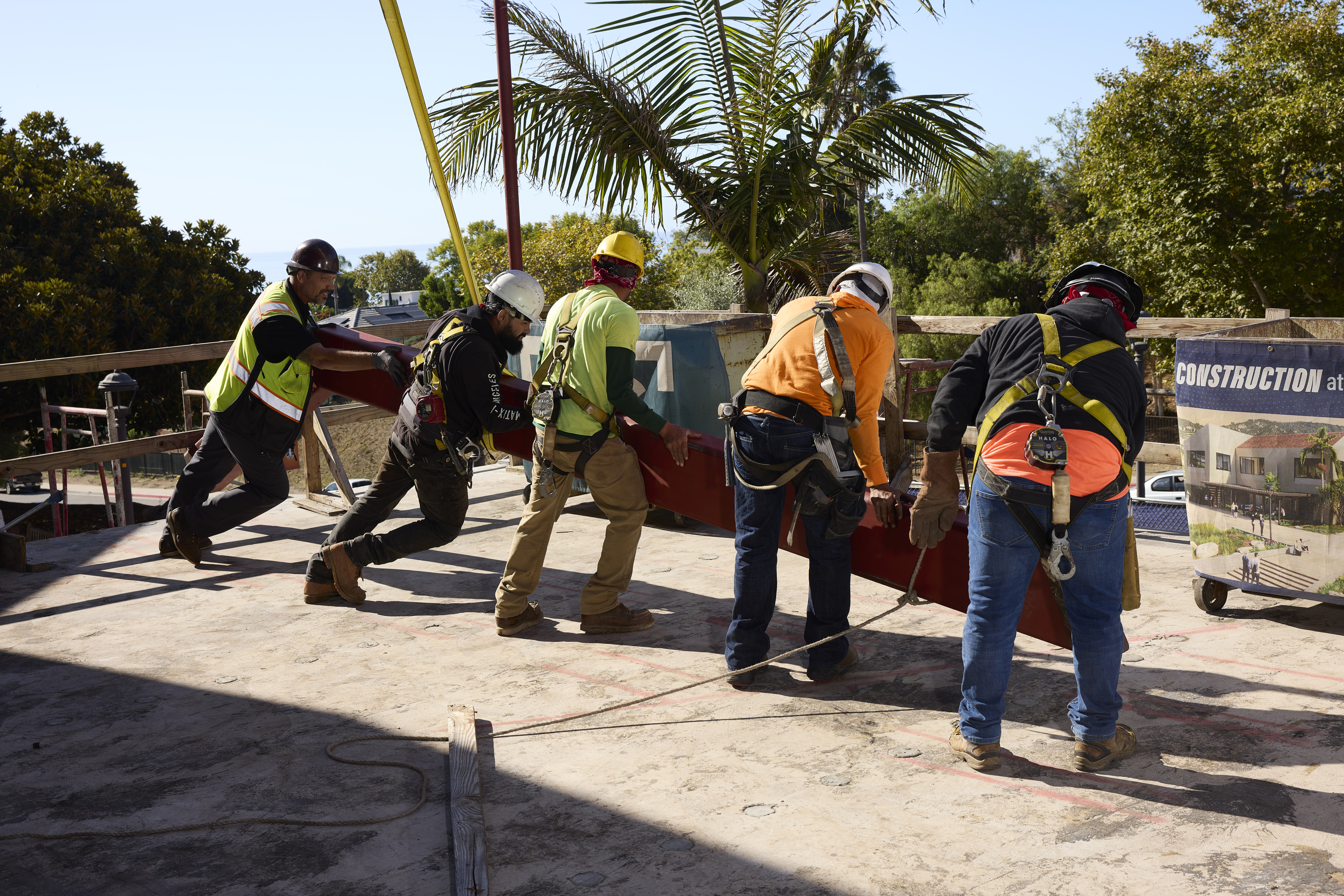 ECC team hoists final beam during topping out ceremony